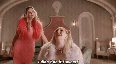 Two Women Standing Next To Each Other GIF