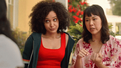 Two Women Standing Next To Each Other With A Netflix Logo On The Bottom Right GIF