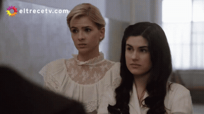 Two Women Standing Next To Each Other With Eltrecetv.com GIF