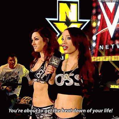 Two Women Standing Next To Each Other With One Saying You 'Re About To Get The Beat Down Of Your Life .. GIF