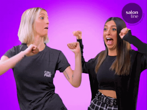 Two Women Standing, One With Girl Pwr Shirt GIF