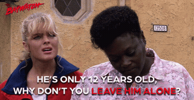 Two Women Standing Next To Each Other With The Words " He 'S Only 12 Years Old Why Don T You Leave Him Alone " GIF