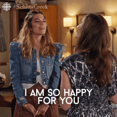 Two Women Standing Next To Each Other With The Words I Am So Happy For You On The Bottom GIF