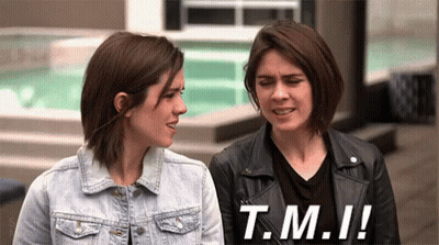 Two Women Standing Next To Each Other With The Words T.m.i. On The Bottom Right GIF