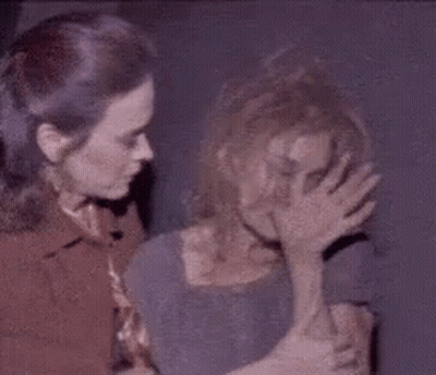 Two Women Standing One Covering Face With Hand GIF
