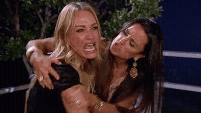 Two Women Standing One Making Funny Face GIF