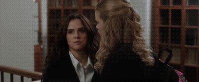 Two Women Standing One With Backpack GIF