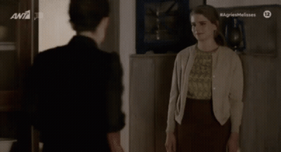 Two Women Standing Saying Agriesmelisses GIF