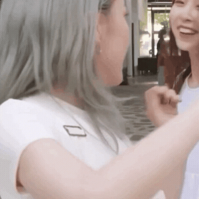 Two Women Standing Side By Side GIF