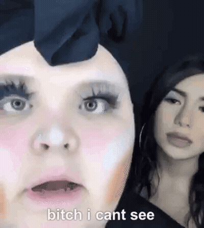 Two Women Standing Side By Side One Wearing Makeup GIF