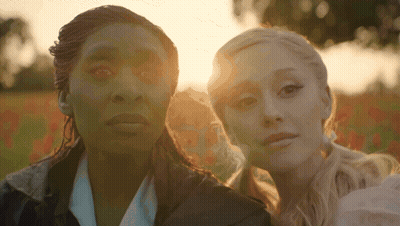 Two Women Standing Together In Sunlight GIF