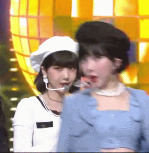Two Women Standing Together One With Beret GIF