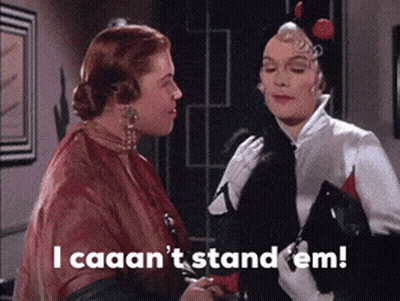Two Women Standing Together Saying I Caaan't Stand Em GIF