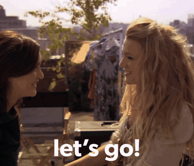 Two Women Standing Together Saying Let's Go GIF