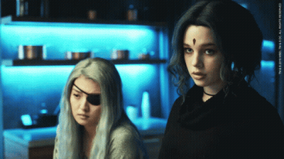 Two Women Standing With TM & 2019 WBEI Watermark GIF