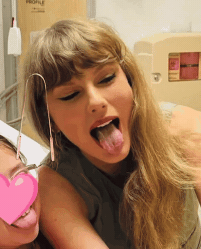 Two Women Sticking Tongues Out At Profile Sign GIF
