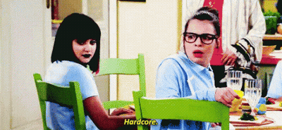 Two Women Talking At Table GIF