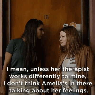 Two Women Talking By Door GIF