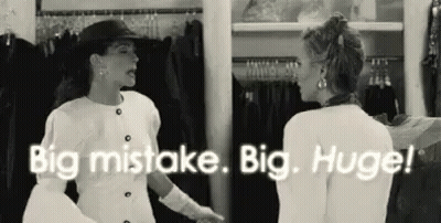 Two Women Talking In Closet GIF