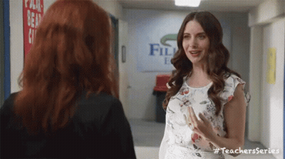 Two Women Talking In Hallway GIF