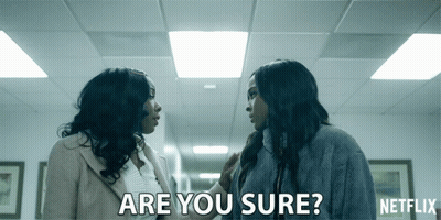 Two Women Talking In Hallway Saying Are You Sure GIF