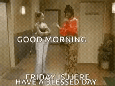 Two Women Talking In Hallway GIF