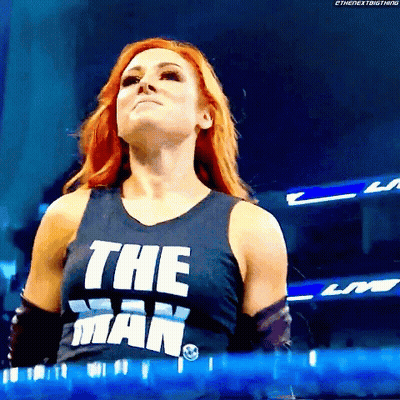 Two Women Talking In Wrestling Ring With WWE Belt GIF