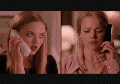 Two Women Talking On Cell Phones GIF