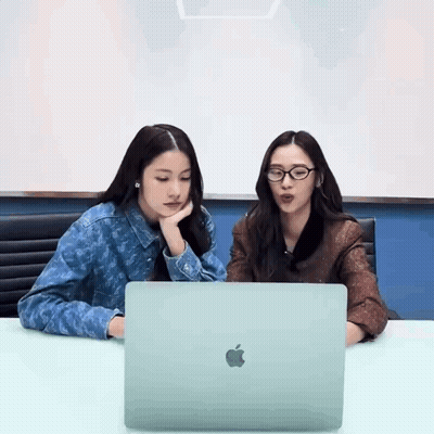 Two Women Using Apple Laptop GIF
