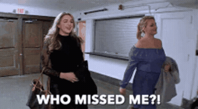 Two Women Walking Down A Hallway With The Words Who Missed Me On The Bottom GIF