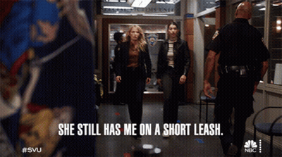 Two Women Walking Down Hallway She Still Has Me On A Short Leash GIF