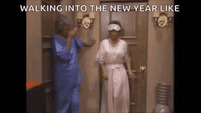 Two Women Walking Into New Year Wearing Sleep Masks GIF