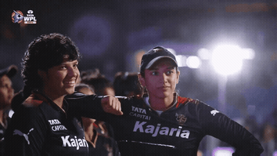 Two Women Wearing Black Shirts With The Word Kajaria On It GIF