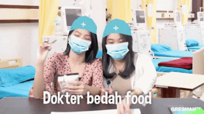 Two Women Wearing Masks And Hats GIF