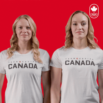 Two Women Wearing White Shirts That Say Canada On Them GIF