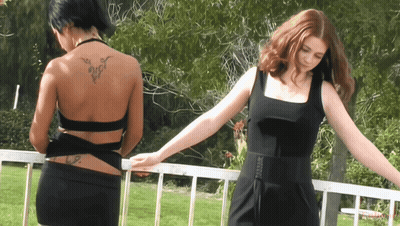 Two Women With Back Tattoos GIF