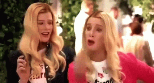 Two Women With Blonde Hair Are Standing Next To Each Other And Talking . GIF