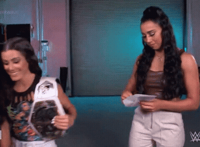 Two Women With Championship Belt GIF