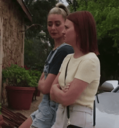 Two Women With Crossed Arms By White Car GIF