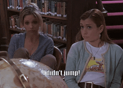 Two Women With Globe Saying I Didn't Jump GIF