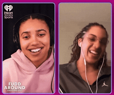 Two Women With Headphones Fudd Around And Find Out GIF
