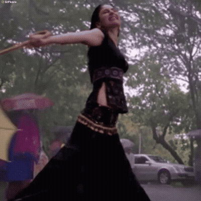 Two Women With Open Mouths And Arms Up GIF