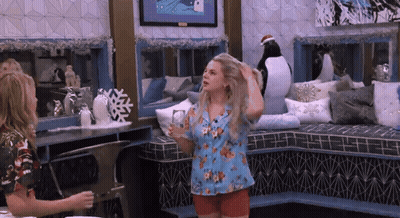 Two Women With Penguin On Wall GIF