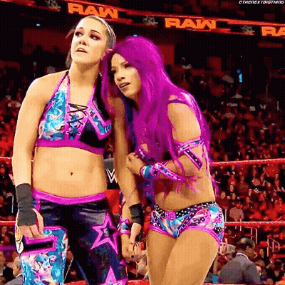 Two Women With Purple Hair Standing In Ring GIF