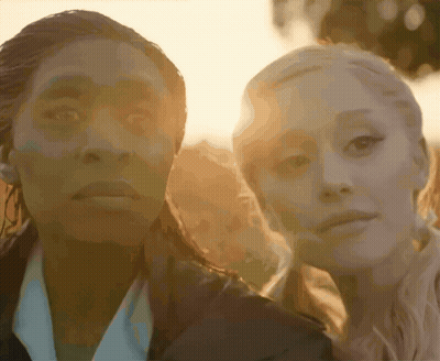 Two Women With Sun Behind Them