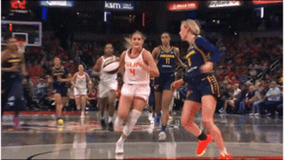 Two Women With Tape On Mouths Sitting In Chair GIF
