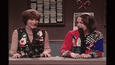 Two Women With Ugly Christmas Sweaters And Microphones GIF