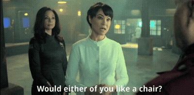 Two Women Would Either Of You Like Chair GIF