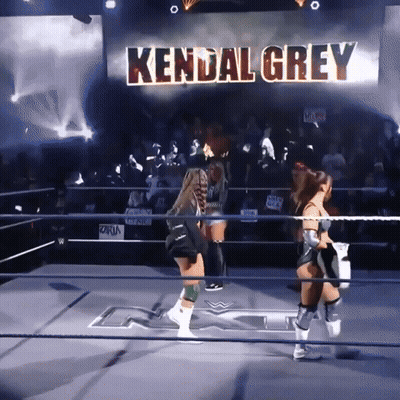 Two Women Wrestling In A Ring With The Name Kendal Grey Behind Them GIF