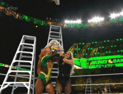 Two Women Wrestling In Front Of Money Ban Sign GIF